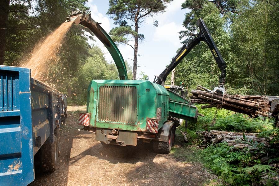 Chipping timber from Tudeley woods for the woodchip boiler at Hadlow Place Farm.